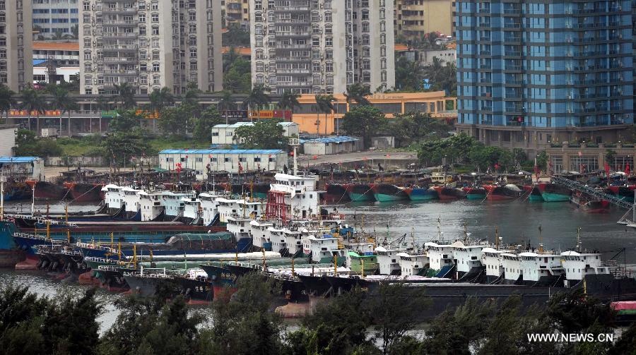 Boats anchor in a harbor in Haikou, capital of south China's Hainan Province, Jun 22, 2013. Tropical storm "Bebinca" is estimated to arrive in south China's Guangdong Province on Saturday afternoon, the first to make landfall in China this year, the National Meteorological Center (NMC) said on Saturday. Affected by the tropical storm, coastal areas in Hainan and Guangdong provinces were battered by gales and torrential rain, the center reported. (Xinhua/Zhao Yingquan) 