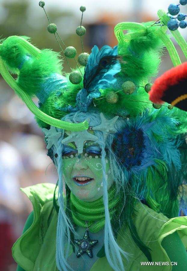 A reveler participates in the 2013 Mermaid Parade at Coney Island in New York on June 22, 2013. (Xinhua/Wang Lei)