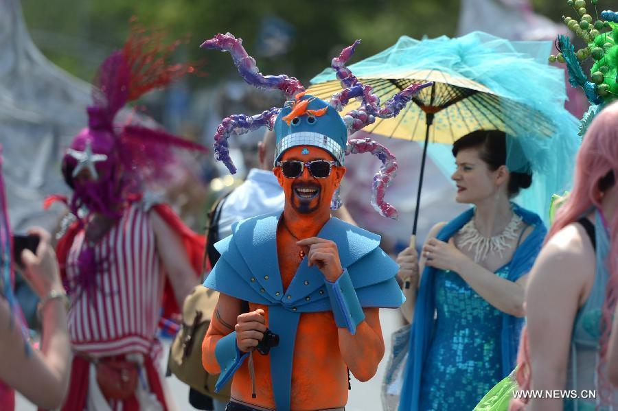 Revelers participate in the 2013 Mermaid Parade at Coney Island in New York on June 22, 2013. (Xinhua/Wang Lei)
