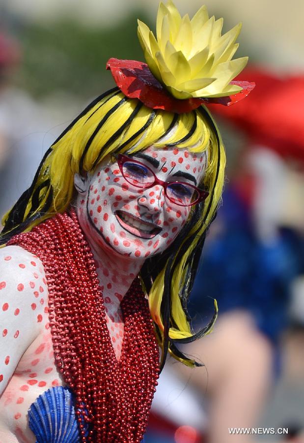 A reveler participates in the 2013 Mermaid Parade at Coney Island in New York on June 22, 2013. (Xinhua/Wang Lei) 