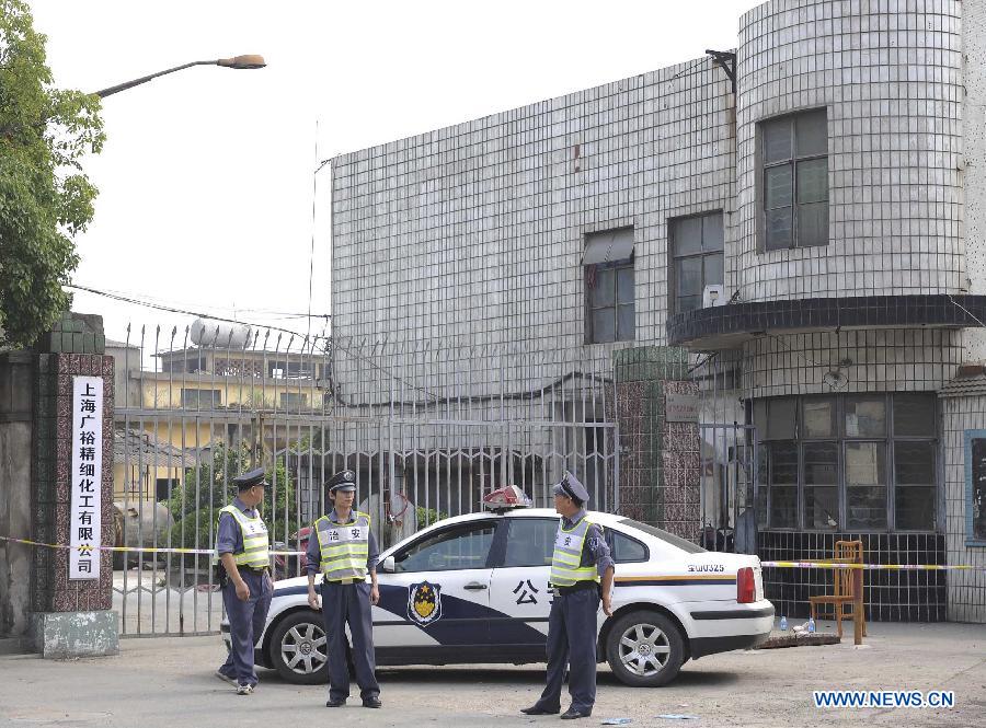 Security staff members guard at the murder site at a chemical factory in Baoshan District, east China's Shanghai Municipality, June 23, 2013. Police arrested late Saturday a 62-year-old man, surnamed Fan, who murdered six people, including four colleagues, a driver and a barracks guard in Shanghai. (Xinhua/Lai Xinlin)
