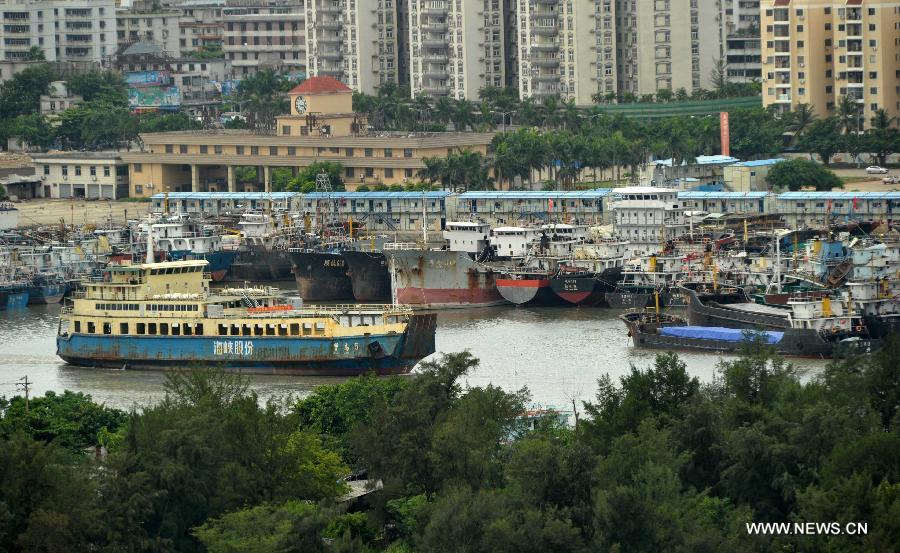 A boat leaves for Xiuying harbor in Haikou, capital of south China's Hainan Province, Jun 23, 2013. Shipping services across Qiongzhou Strait, which links the Hainan island and the mainland, partly resumed Sunday morning as the impact of the tropical storm "Bebinca" weakened. (Xinhua/Zhao Yingquan)