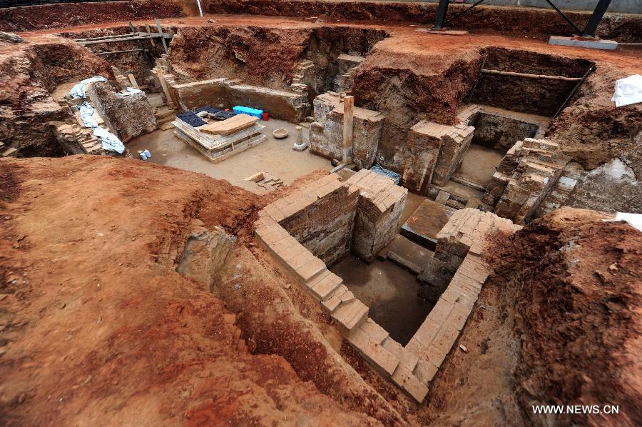 Photo taken on June 22, 2013 shows the archeological site of an ancient tomb in Fangshan District of Beijing, capital of China. A gravestone excavated from the tomb confirmed that the tomb was the final resting place of Liu Ji, a regional military governor of the Tang Dynasty (618-907), and his wife. Archaeologists have started a salvage excavation of the tumulus since August 2012, after it was accidentally discovered at a local construction site. Valuable cultural relics, including an exquisite stone coffin bed, were discovered. (Xinhua/Luo Xiaoguang)