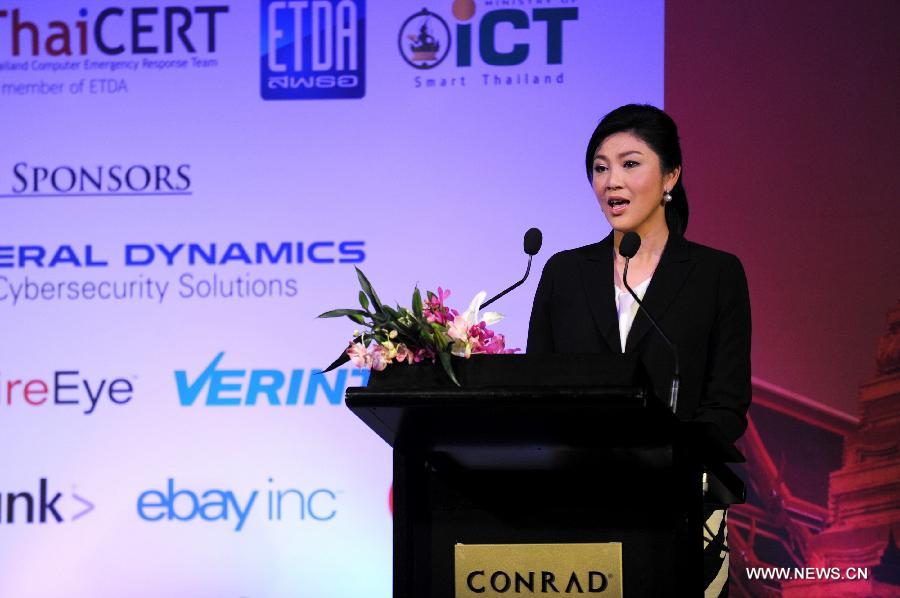 Thai Prime Minister Yingluck Shinawatra speaks during the opening ceremony of the 25th annual Forum of Incident Response and Security Teams (FIRST) conference in Bangkok, capital of Thailand, June 17, 2013. Under the theme of "Incident Response: Sharing to win", the five-day conference brings together leading experts from all over the world to share ideas on international security. (Xinhua/Gao Jianjun)