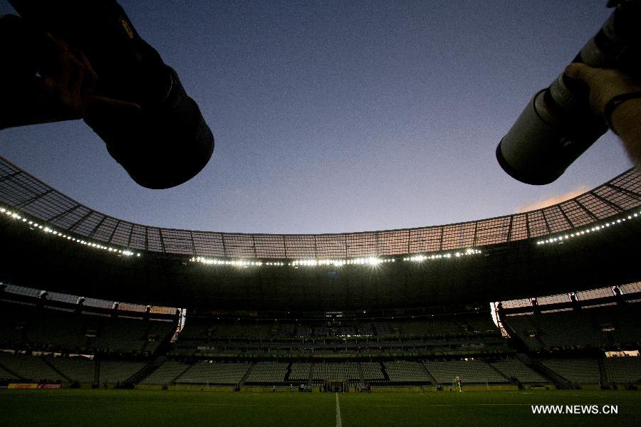 Photographers are prepared to cover a training session of Mexico's National Soccer Team at the Castelao Stadium, in Fortaleza, Brazil, on June 18, 2013. Mexico will face Brazil on Wednesday in its second match during the the FIFA Confederations Cup Brazil 2013. (Xinhua/Guillermo Arias)