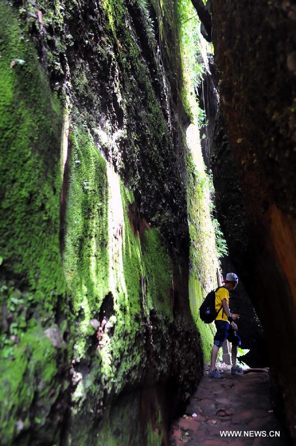 Photo taken on June 22, 2013 shows a view of Mountain Danxiashan, in Shaoguan City, south China's Guangdong Province. Mountain Danxiashan entered a peak tourist season recently with the coming of summer. (Xinhua/Chen Haining) 