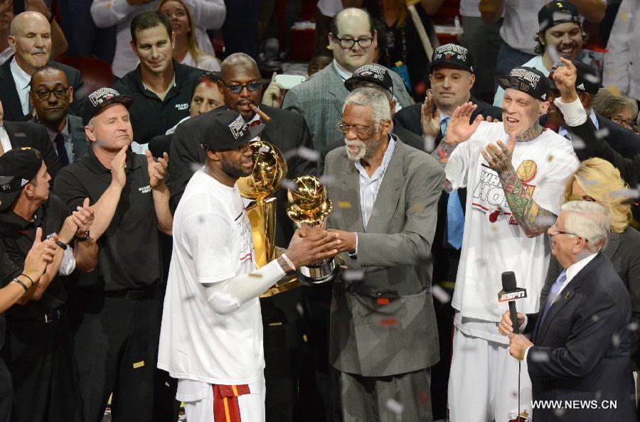 LeBron James (Front, L) of Miami Heat is presented with MVP trophy after the game 7 of the NBA finals against San Antonio Spurs in Miami, the United States on June 20, 2013. Heat defeated Spurs 95-88 and won the champion. (Xinhua/Wang Lei)