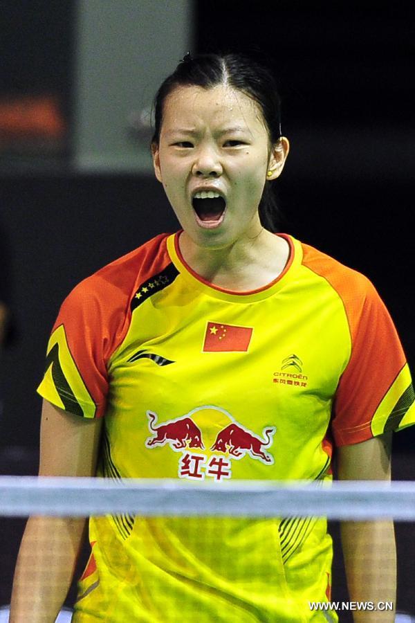 Li Xuerui of China reacts during her women's singles semi-final match against Sun Yu of China in the Singapore Open badminton tournament in Singapore, June 22, 2013. Li Xuerui won 2-0. (Xinhua/Then Chih Wey)