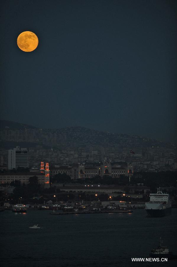 The moon is seen in the sky over Istanbul on June 23, 2013. On Sunday, a perigee moon coincided with a full moon creating a "super moon" when it passed by the earth at its closest point in 2013. (Xinhua/Lu Zhe)