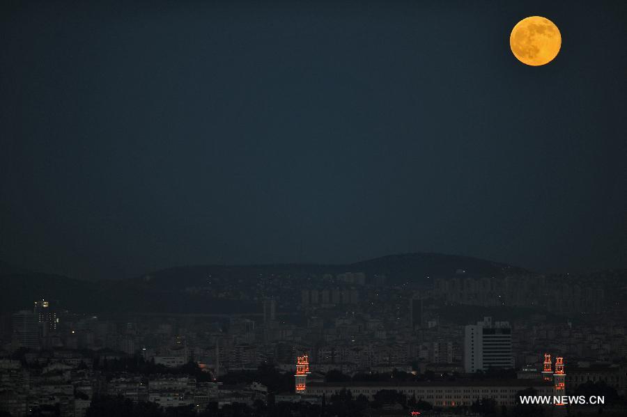 The moon is seen in the sky over Istanbul on June 23, 2013. On Sunday, a perigee moon coincided with a full moon creating a "super moon" when it passed by the earth at its closest point in 2013. (Xinhua/Lu Zhe)