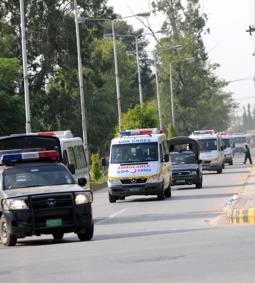 Ambulances transporting bodies of foreign tourists leave Chaklala Airbase in Rawalpindi, Pakistan, on June 23, 2013. Two Chinese nationals and one Chinese American were among the 11 people killed in a pre-dawn terrorist attack in Pakistan's northern area of Gilgit-Baltistan on Sunday, the Chinese Embassy in Pakistan told Xinhua. (Xinhua/Ahmad Kamal) 