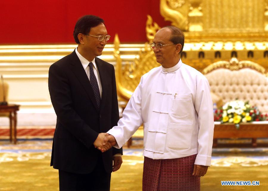 Myanmar President U Thein Sein (R) shakes hands with visiting Chinese State Councilor Yang Jiechi during a meeting with him in Nay Pyi Taw, Myanmar, June 24, 2013. Yang Jiechi arrived in Myanmar Sunday for a two-day visit at the invitation of the government of Myanmar. (Xinhua/U Aung)