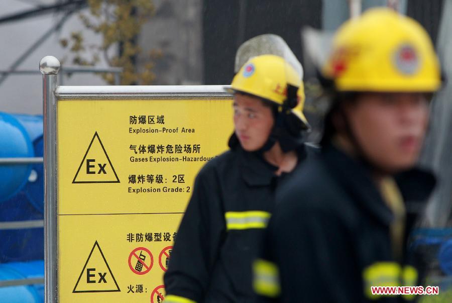 A fire warning sign is seen at the accident site after an explosion happened in a chemical plant in the Jinshan district of east China's Shanghai, June 24, 2013. Six people were injured in the accident at about 2:15 p.m. The fire has been extinguished as of 3:30 p.m.. (Xinhua/Ding Ting)