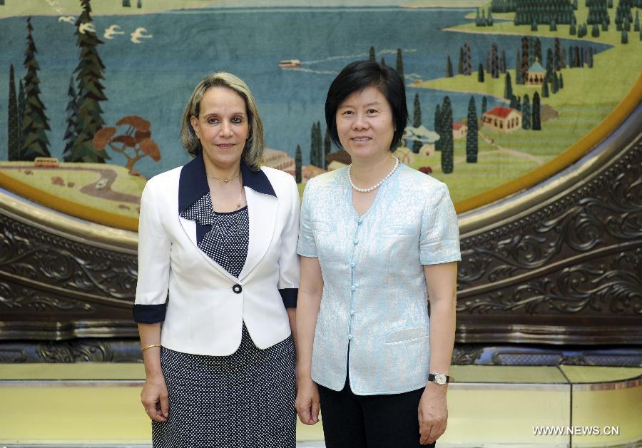 Shen Yueyue (R), vice chairwoman of the Standing Committee of the National People's Congress and president of the All-China Women's Federation, meets with a visiting Algerian women delegation in Beijing, capital of China, June 24, 2013. (Xinhua/Zhang Duo)