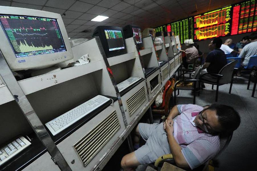 A stock investor takes a nap in the security exchange. (File Photo) 
