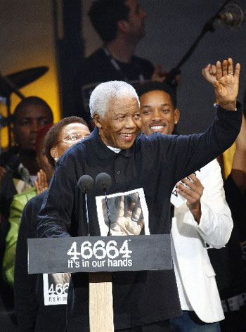 Former South African President Nelson Mandela waves during the 46664 concert held in his honour in Hyde Park, London June 27, 2008. (Xinhua/Reuters Photo)