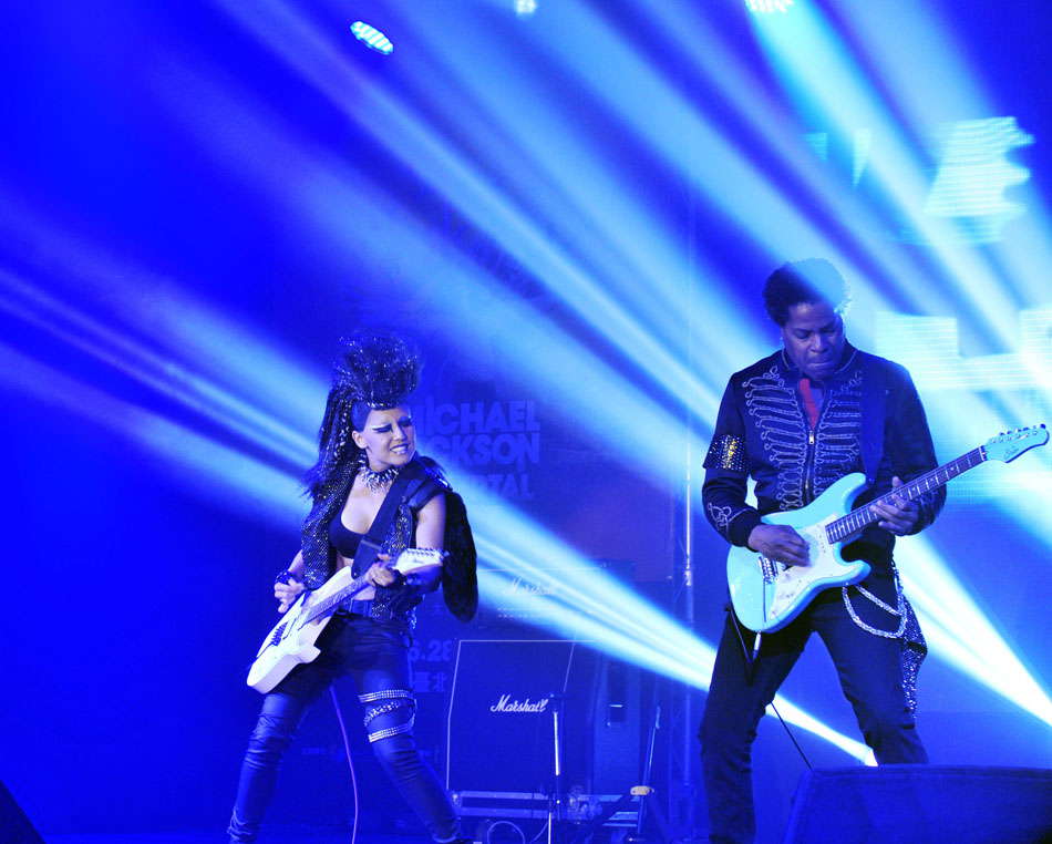 Guitar players perform during a press conference for the Michael Jackson The Immortal World Tour in Taipei, southeast China's Taiwan, June 18, 2013. The world tour concert will be held in the Taipei Arena from June 28 to June 30, and will be held in Beijing, Shanghai and Hong Kong in August. (Photo by Wu Jingteng/ Xinhua)