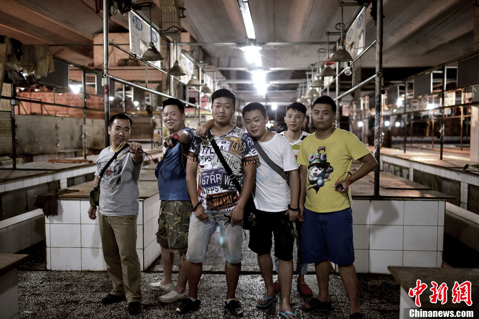 Six young men form a "rat hunting team" to kill rats in a farmer’s market. (Photo/ CNS) 