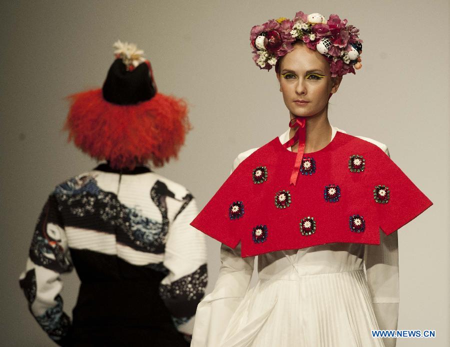 Models present creations by graduates from the Institute of Textiles and Clothing in Hong Kong Polytechnic University during their graduation show in Hong Kong, south China, June 26, 2013. (Xinhua/Lui Siu Wai)