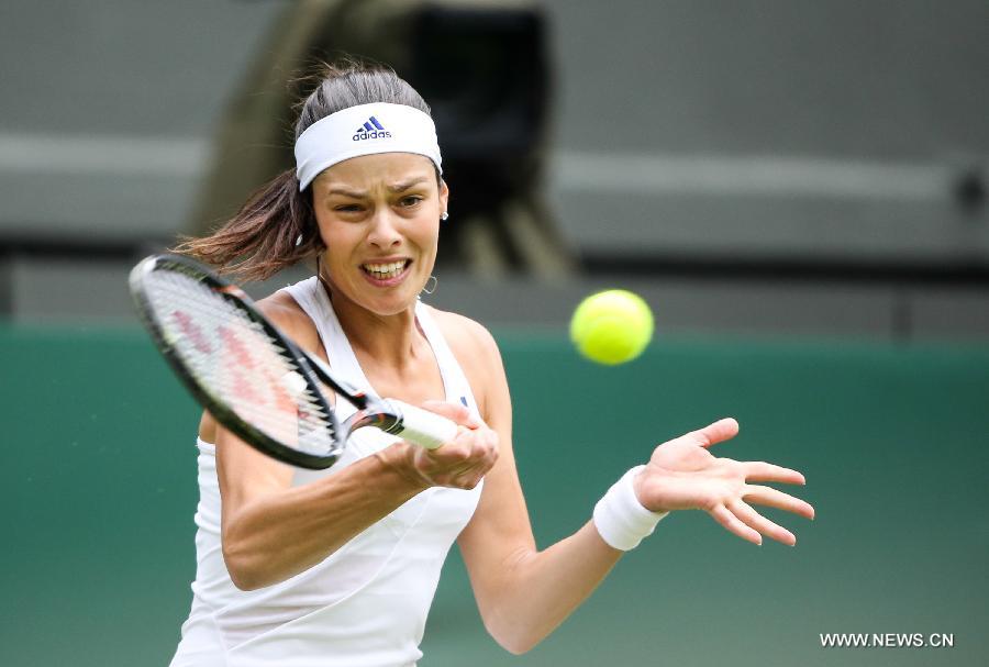 Ana Ivanovic of Serbia competes during the second round of ladies' singles against Eugenie Bouchard of Canada on day 3 of the Wimbledon Lawn Tennis Championships at the All England Lawn Tennis and Croquet Club in London, Britain on June 26, 2013. Ivanovic lost 0-2.(Xinhua/Tang Shi)