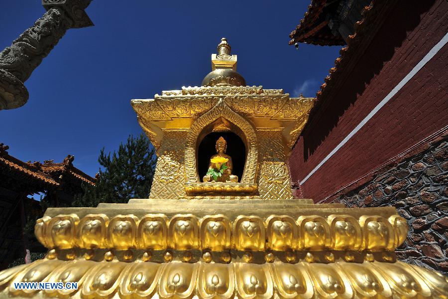 Photo taken on June 26, 2013 shows a pagoda on Mount Wutai, one of four sacred Buddhist mountains in China, in north China's Shanxi Province. Added to UNESCO's World Heritage List in 2009, Mount Wutai is home to about 50 Buddhist temples built between the 1st century AD and the early 20th century. (Xinhua/Zhan Yan)