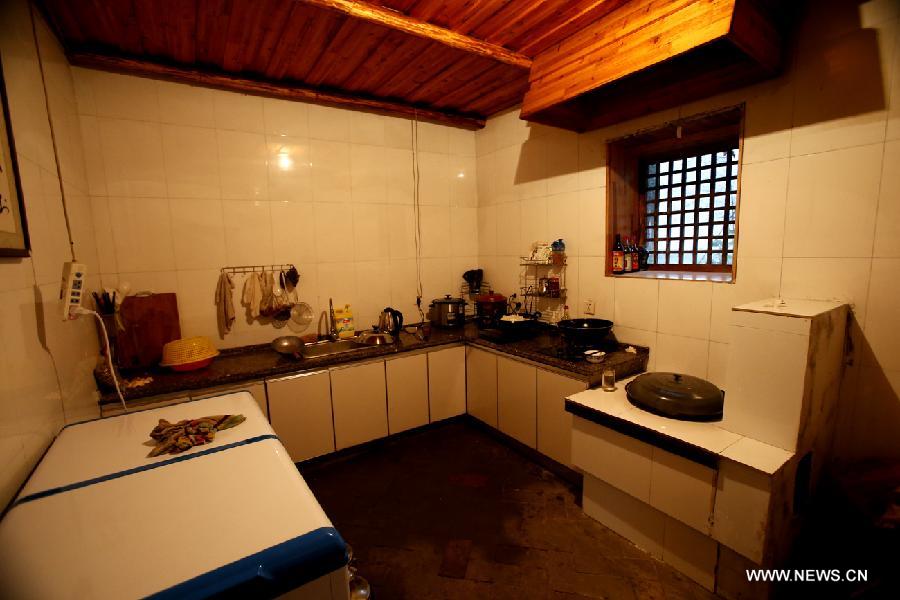 Photo taken on June 20, 2013 shows the view of a kitchen of a local residence in the Haotang Village of Xinyang City, central China's Henan Province. (Xinhua/Li Mingfang) 