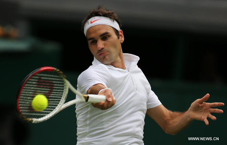 Roger Federer of Switzerland reacts during the second round of men's singles against Sergiy Stakhovsky of Ukraine on day 3 of the Wimbledon Lawn Tennis Championships at the All England Lawn Tennis and Croquet Club in London, Britain, on June 26, 2013. Roger Federer lost 1-3. (Xinhua/Yin Gang)