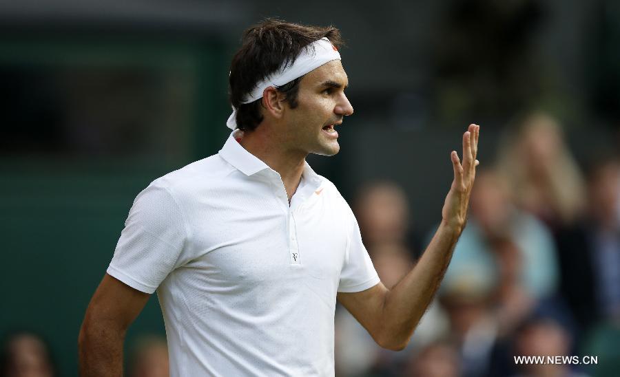 Roger Federer of Switzerland reacts during the second round of men's singles against Sergiy Stakhovsky of Ukraine on day 3 of the Wimbledon Lawn Tennis Championships at the All England Lawn Tennis and Croquet Club in London, Britain, on June 26, 2013. Roger Federer lost 1-3. (Xinhua/Yin Gang)