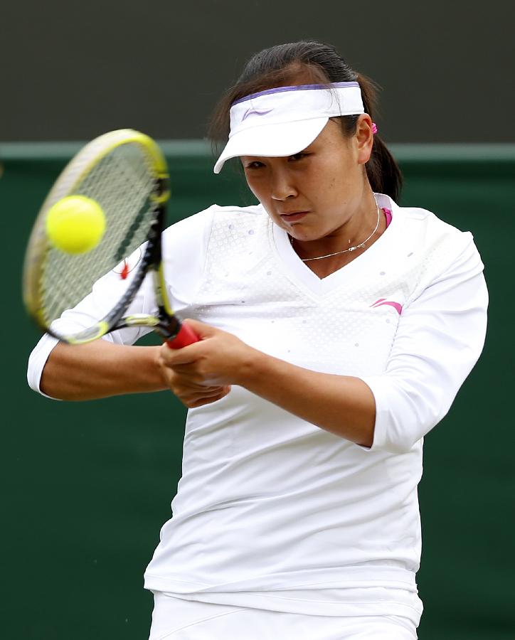 Peng Shuai of China returns the ball during the second round of ladies' singles against Marina Erakovic of New Zealand on day 4 of the Wimbledon Lawn Tennis Championships at the All England Lawn Tennis and Croquet Club in London, Britain on June 27, 2013. (Xinhua/Wang Lili)