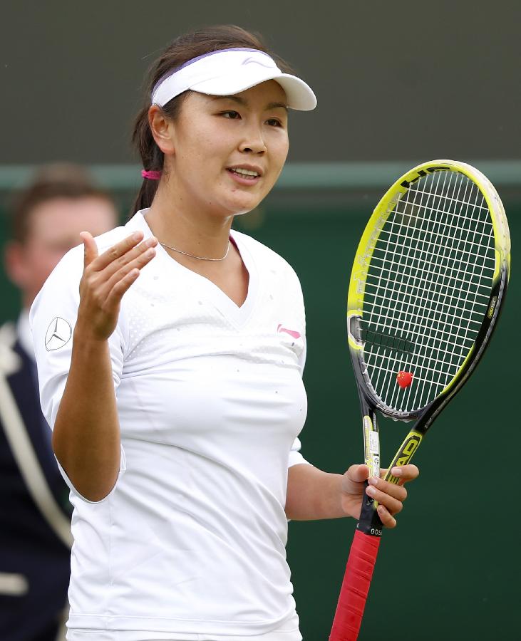 Peng Shuai of China reacts during the second round of ladies' singles against Marina Erakovic of New Zealand on day 4 of the Wimbledon Lawn Tennis Championships at the All England Lawn Tennis and Croquet Club in London, Britain on June 27, 2013. (Xinhua/Wang Lili)