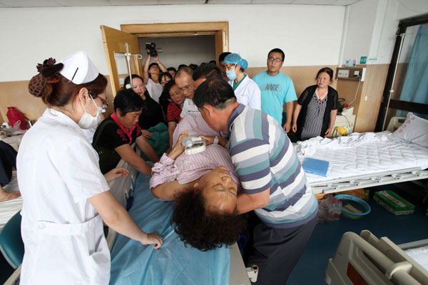 Wang Chuanli after her operation, June 27, 2013. [Photo/Xinhua]
