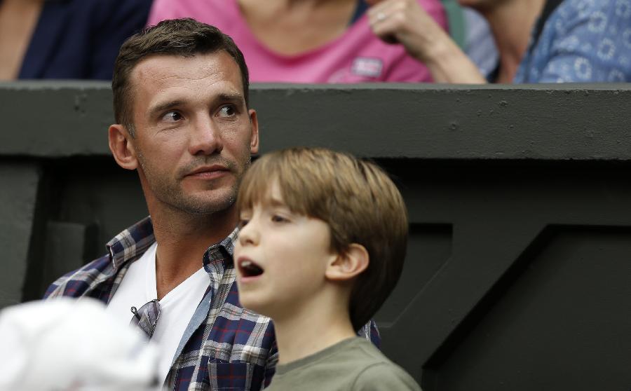 Andriy Mykolayovych Shevchenko (L), a retired Ukrainian footballer and a current Ukrainian politician, watches the second round match of men's singles between Novak Djokovic of Serbia and Bobby Reynolds of the United States on day 4 of the Wimbledon Lawn Tennis Championships at the All England Lawn Tennis and Croquet Club in London, Britain, on June 27, 2013. Novak Djokovic won 3-0. (Xinhua/Wang Lili)