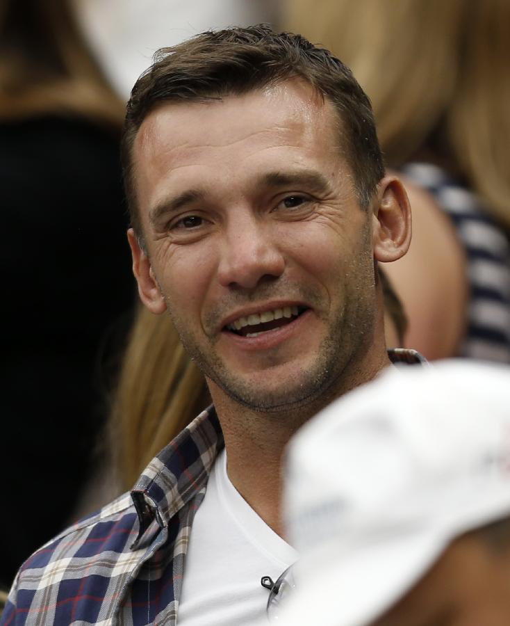 Andriy Mykolayovych Shevchenko (L), a retired Ukrainian footballer and a current Ukrainian politician, watches the second round match of men's singles between Novak Djokovic of Serbia and Bobby Reynolds of the United States on day 4 of the Wimbledon Lawn Tennis Championships at the All England Lawn Tennis and Croquet Club in London, Britain, on June 27, 2013. Novak Djokovic won 3-0. (Xinhua/Wang Lili)