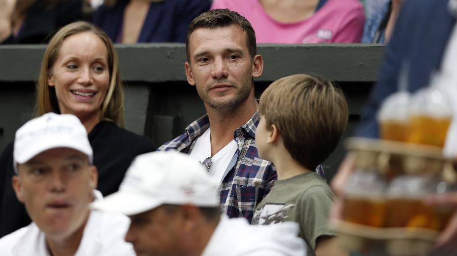 Andriy Mykolayovych Shevchenko (C), a retired Ukrainian footballer and a current Ukrainian politician, watches the second round match of men's singles between Novak Djokovic of Serbia and Bobby Reynolds of the United States on day 4 of the Wimbledon Lawn Tennis Championships at the All England Lawn Tennis and Croquet Club in London, Britain, on June 27, 2013. Novak Djokovic won 3-0. (Xinhua/Wang Lili)