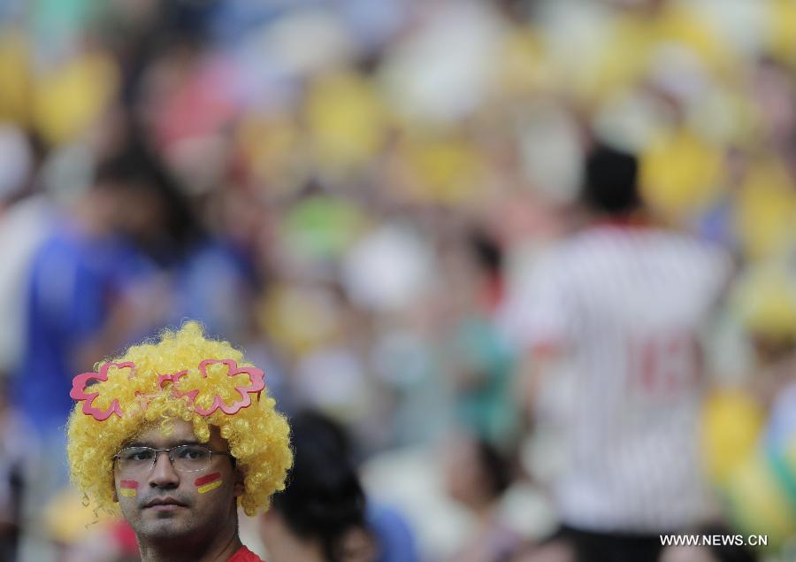 A fan of Spain reacts prior to the FIFA's Confederations Cup Brazil 2013 semifinal match against Italy held at Castelao Stadium in Fortaleza, Brazil, on June 27, 2013. Spain won 7-6 in a penalty shoot-out. (Xinhua/Guillermo Arias)