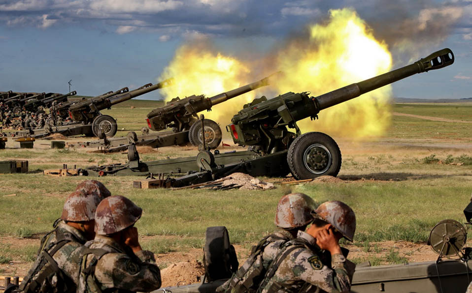 Officers and men in live-ammunition firing drill