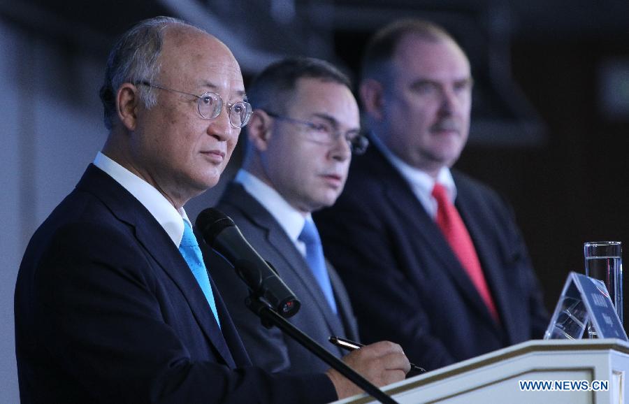 Yukiya Amano (L), director general of the International Atomic Energy Agency (IAEA), attends a three-day ministerial conference on nuclear energy in St. Petersburg, Russia, on June 27, 2013. The world should make every effort to restore public confidence in nuclear energy and enhance its safety and sustainability, said Yukiya Amano on Thursday. (Xinhua/Lu Jinbo)