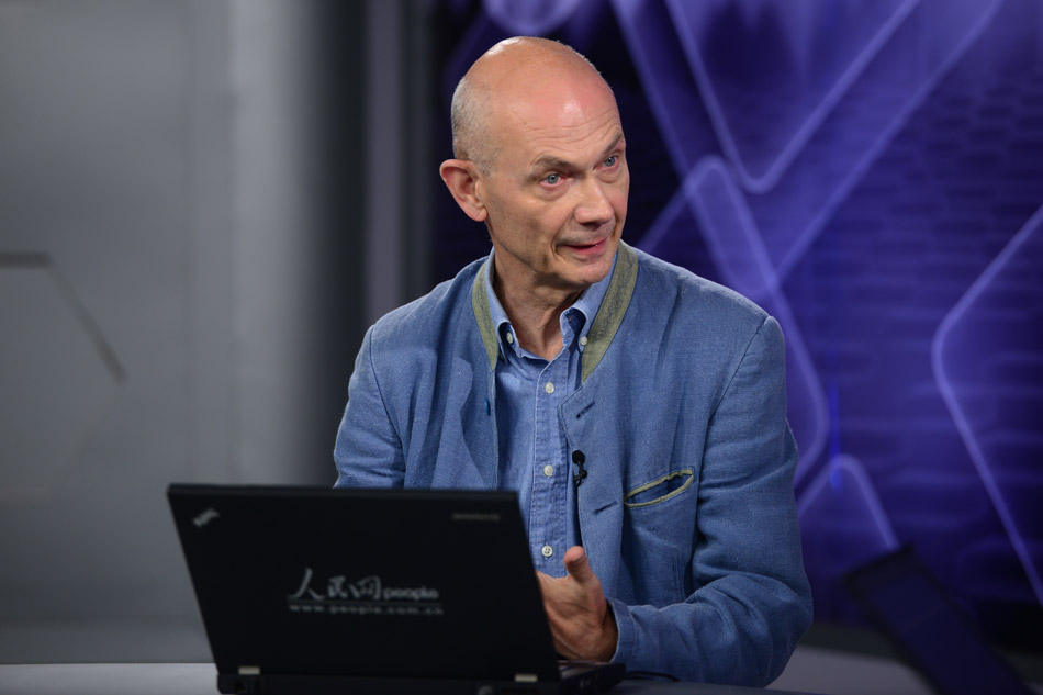 WTO Director General Pascal Lamy receives a video interview at People's Daily Online on June 29, 2013. (People's Daily Online/ Yu Kai)