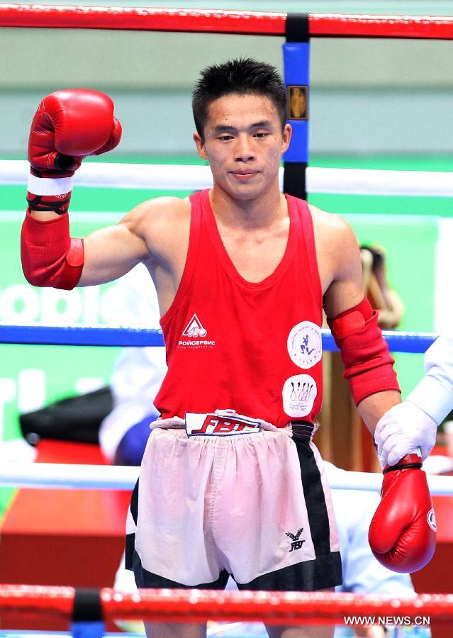 Li Gang of China celebrates after his Muay men's 54kg quarterfinal fight against Murad Ahmed Salan Murad of Iraq during the 4th Asian Indoor and Martial Arts Games (AIMAG) in Incheon, South Korea, June 30, 2013. Li Gang won 5-0. (Xinhua/Park Jin-hee)