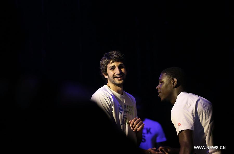 NBA stars Jrue Holiday from Philadelphia 76ers and Ricky Rubio (L) from Minnesota Timberwolves chat during a business event in Beijing, capital of China, June 30, 2013. Four NBA stars Jrue Holiday from Philadelphia 76ers, Ricky Rubio from Minnesota Timberwolves, Damian Lillard from Portland Trail Blazers and John Wall from Washington Wizards shared their basketball skills and funs with Chinese fans during a business event in Beijing on Sunday. (Xinhua/Li Ming)