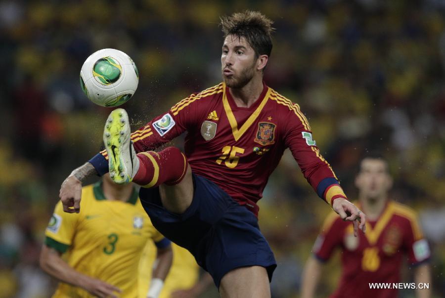 Spain's Sergio Ramos controls the ball during the final of the FIFA's Confederations Cup Brazil 2013 match against Brazil, held at Maracana Stadium, in Rio de Janeiro, Brazil, on June 30, 2013. (Xinhua/Guillermo Arias)