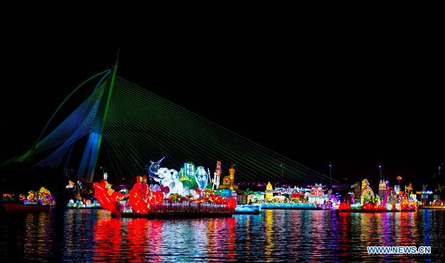 Floats attend a night parade activity in Putrajaya, Malaysia, June 30, 2013. (Xinhua/Chong Voon Chung)