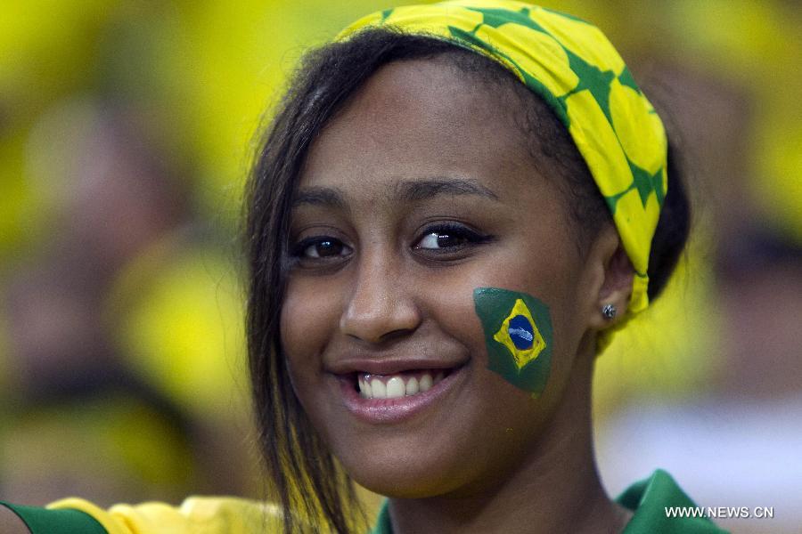 A fan reacts during the closure ceremony of the FIFA's Confederations Cup Brazil 2013 in Rio de Janeiro, Brazil, on June 30, 2013. (Xinhua/David de la Paz)
