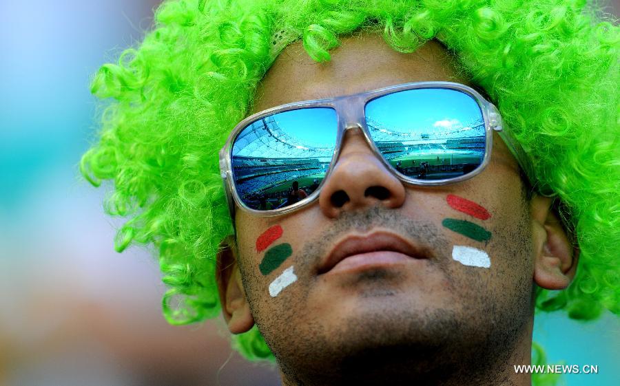 A fan reacts prior to the FIFA's Confederations Cup Brazil 2013 match for the third place between Uruguay and Italy in Salvador, Brazil, on June 30, 2013. (Xinhua/Nicolas Celaya)