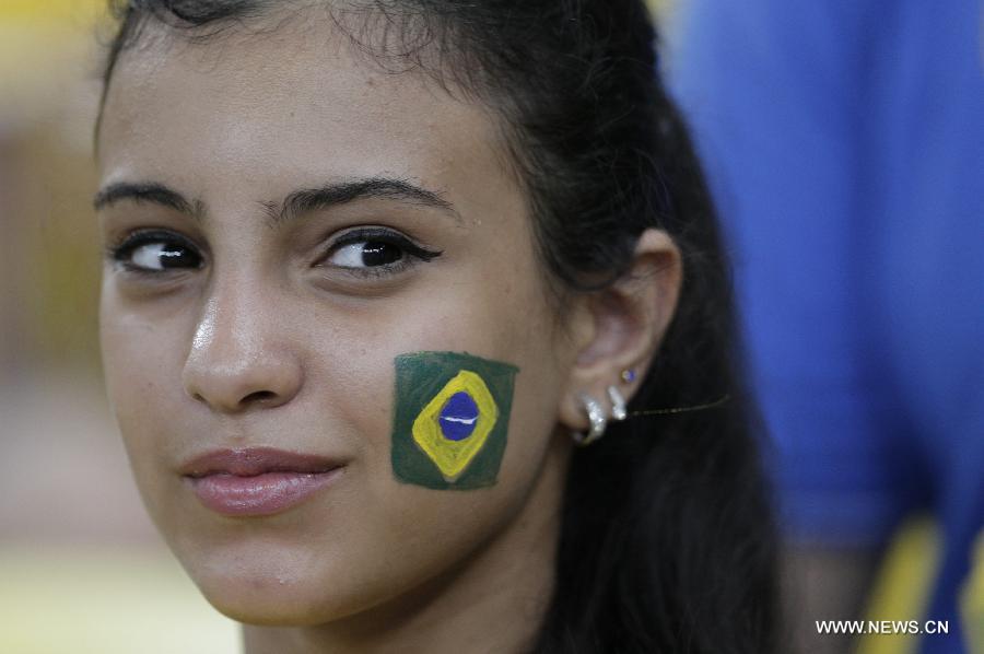 A fan reacts during the closure ceremony of the FIFA's Confederations Cup Brazil 2013 in Rio de Janeiro, Brazil, on June 30, 2013. (Xinhua/Guillermo Arias)
