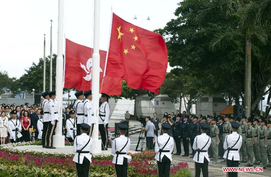 A flag-raising ceremony is held to celebrate the 16th anniversary of Hong Kong's return to the motherland, in Hong Kong, south China, July 1, 2013. (Xinhua/Lui Siu Wai)