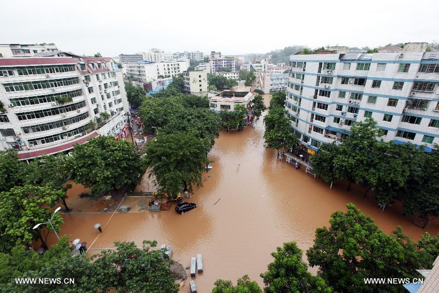 Photo taken on July 1, 2013 shows waterlogged roads in Tongliang County of Chongqing, southwest China. Rainstorms swept the county on Sunday and Monday, waterlogging roads and houses. (Xinhua/Tang Mingbing) 