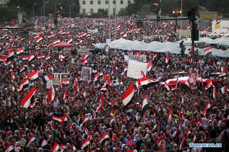 Egyptian anti-President Mohammed Morsi protesters gather during a rally at Tahrir Square in Cairo, July 1, 2013. The Egyptian military issued a statement hours ago, giving "all parties" a 48-hour deadline to respond to the demands of the people, has been seen by security and political experts as necessary to resolve the current political crisis in the turmoil-stricken country. (Xinhua/Wissam Nasser)