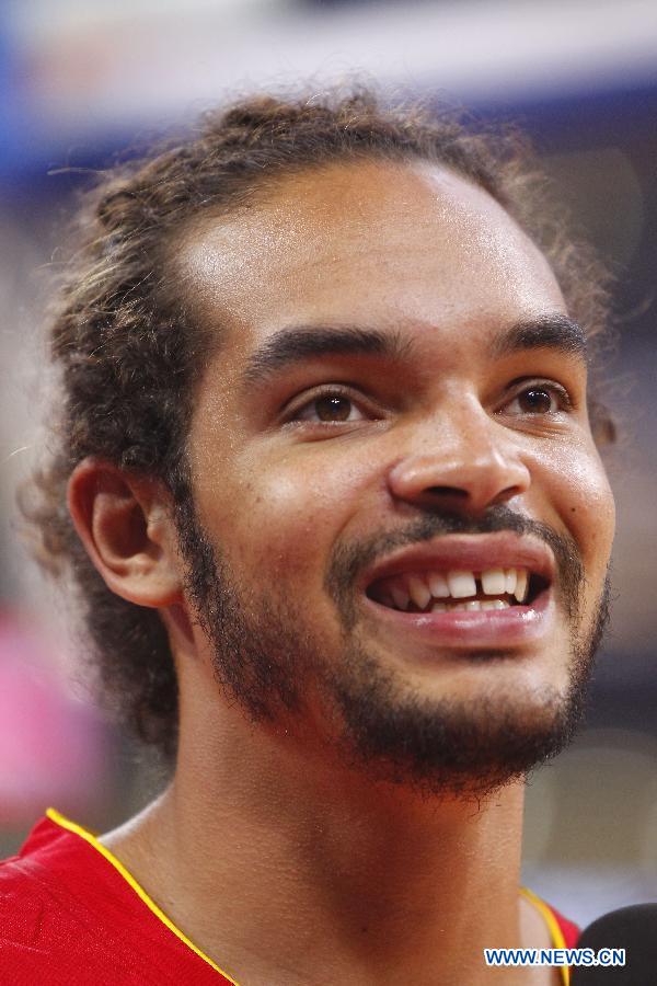 NBA star Joakim Noah reacts before a Yao Foundation Charity Game, sponsored by former Chinese basketball star Yao Ming, between the Chinese team and a team of NBA stars in Beijing, China, July 1, 2013. (Xinhua/Ding Xu)