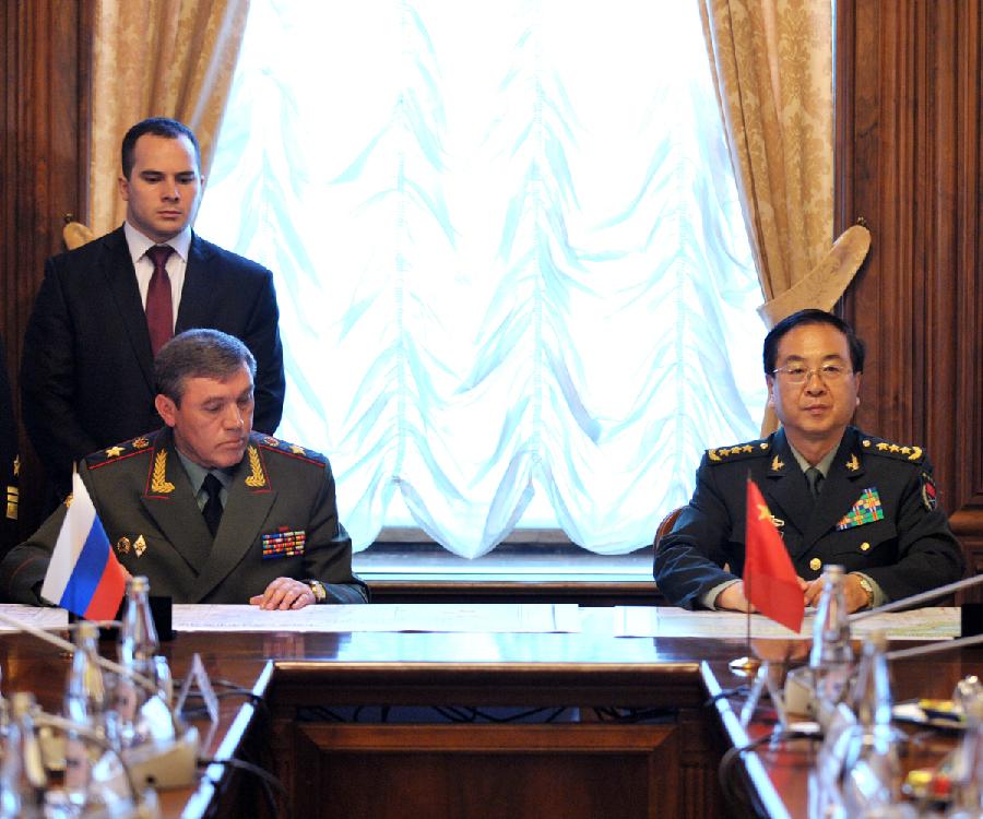 Fang Fenghui (R) , chief of the General Staff of the Chinese People' s Liberation Army (PLA), and his Russian counterpart Valery Gerasimov (Front L), attend a joint press conference in Moscow, Russia, on July 1, 2013. China and Russia will hold two joint military drills in the coming two months. Chinese and Russian armed forces will hold "Joint Sea-2013" drill in Peter the Great Bay, Sea of Japan from July 5 to July 12, and China-Russia joint anti-terrorism military drill code-named Peace Mission-2013 in Russia's Chelyabinsk from July 27 to August 15. (Xinhua/Li Xiaowei)